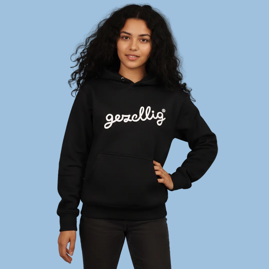 Girl wearing a black Gezellig hoodie with off-white logo