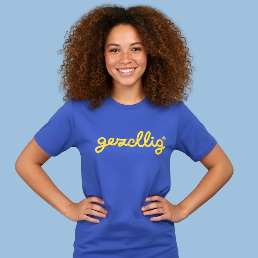 Person wearing a Gezellig blue t-shirt with yellow logo on a blue background