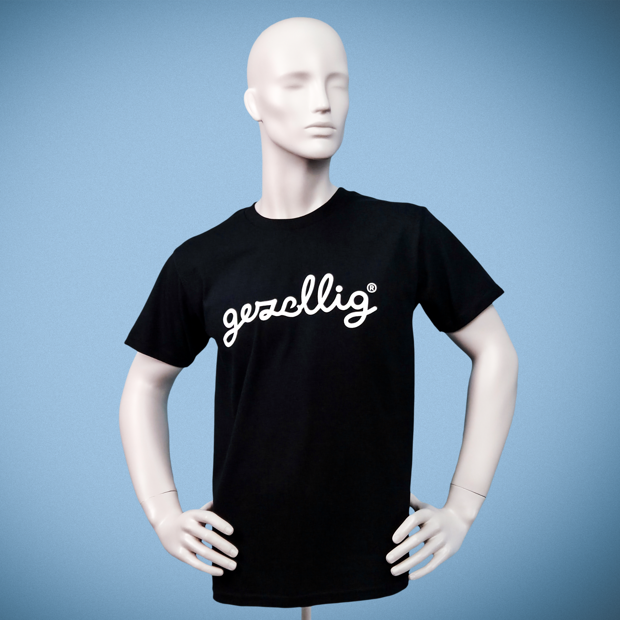 Mannequin wearing a black t-shirt with 'gezellig' in off white
