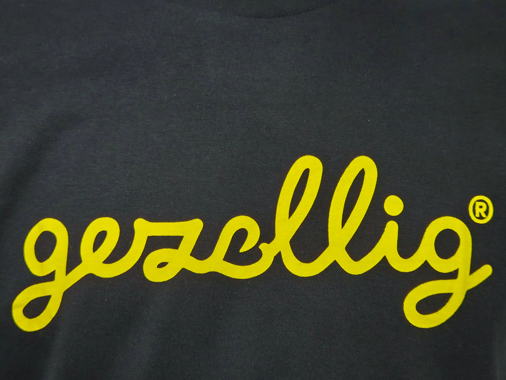 Black t-shirt with yellow 'gezellig' logo
